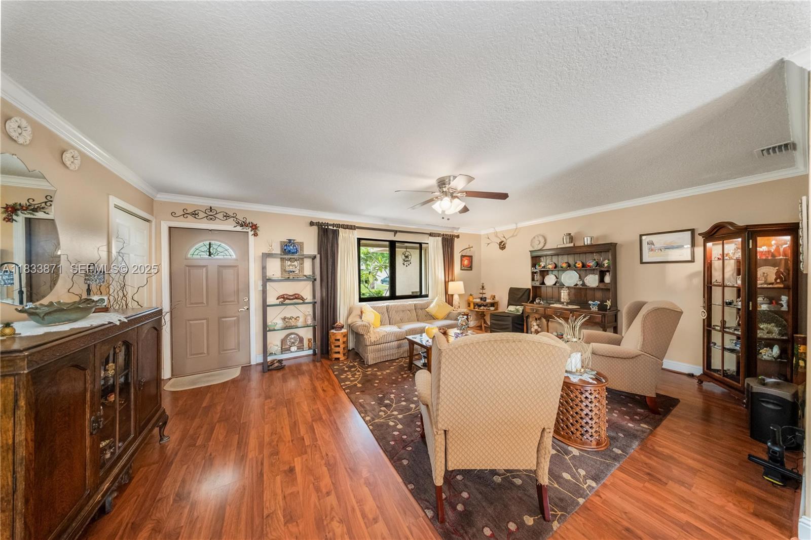 11193 Southwest 113th Terrace Miami, FL 33176 - Photo 8 of 43 a living room with furniture and wooden floor