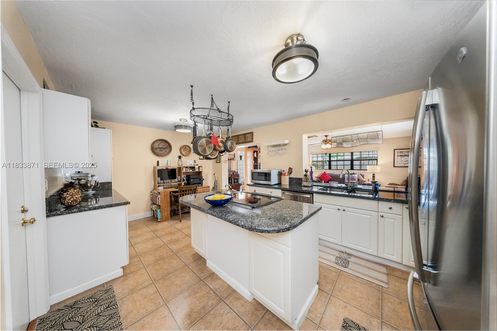 11193 Southwest 113th Terrace Miami, FL 33176 - Photo 9 of 43 a kitchen with refrigerator and cabinets