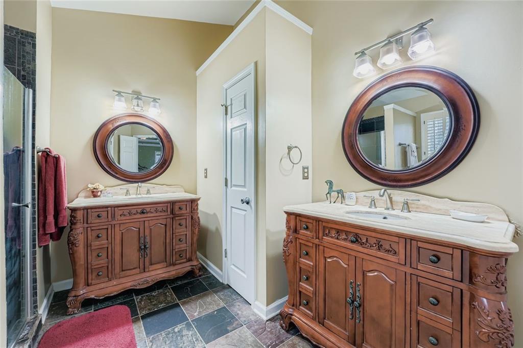 932 Huntsman Trace Lawrenceville, GA 30045 - Photo 16 of 30 a bathroom with a sink and a mirror