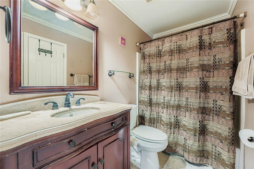 932 Huntsman Trace Lawrenceville, GA 30045 - Photo 18 of 30 a bathroom with a sink toilet and shower