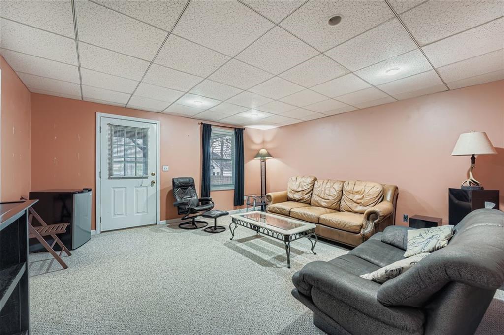 932 Huntsman Trace Lawrenceville, GA 30045 - Photo 23 of 30 a living room with furniture and a window