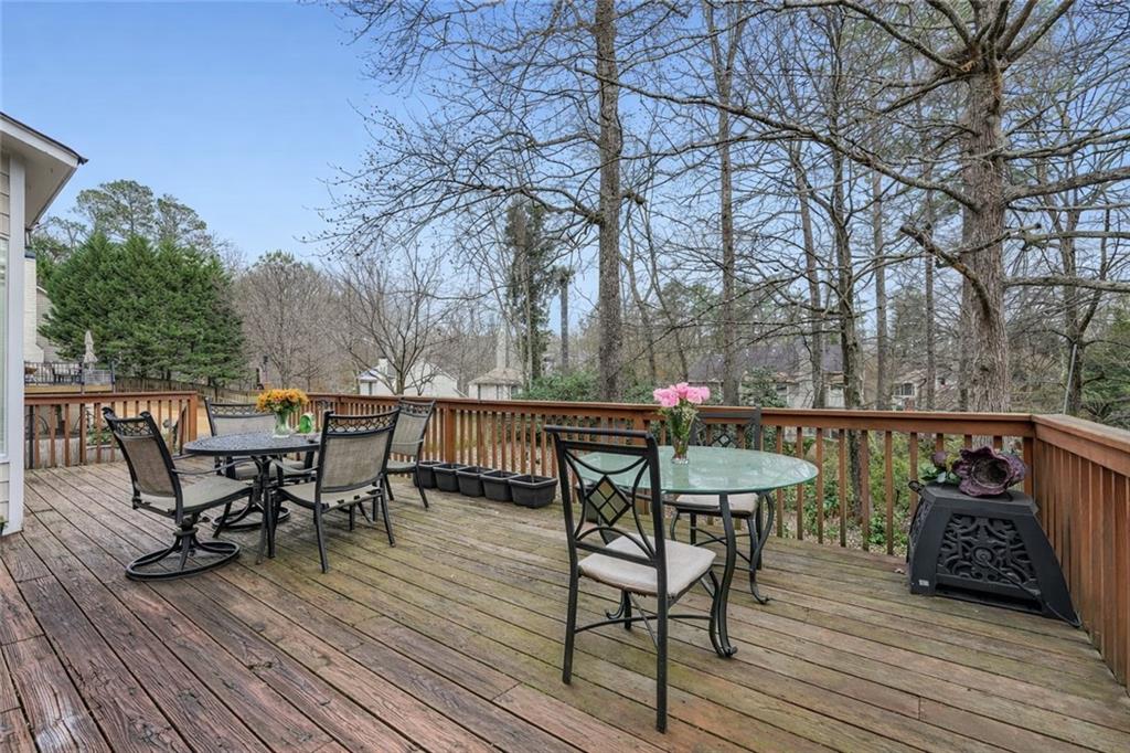 932 Huntsman Trace Lawrenceville, GA 30045 - Photo 27 of 30 a view of a chairs and table on the wooden floor