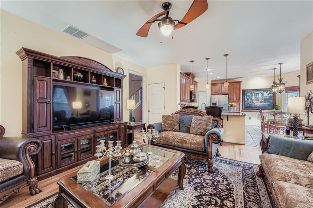 932 Huntsman Trace Lawrenceville, GA 30045 - Photo 5 of 30 a living room with furniture and a flat screen tv