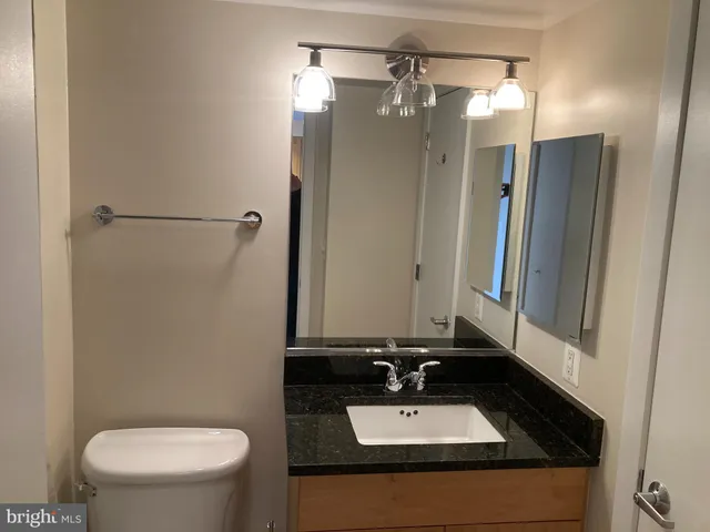 a bathroom with a shower and a sink