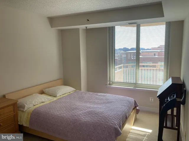 a view of a bedroom from a hallway