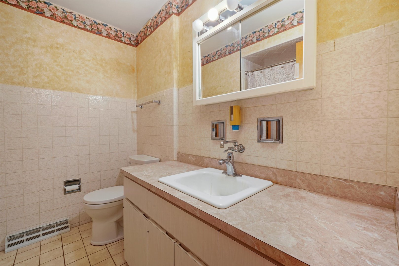 1350 Perry Street Crete, IL 60417 - Photo 12 of 17 a bathroom with a sink a toilet and mirror