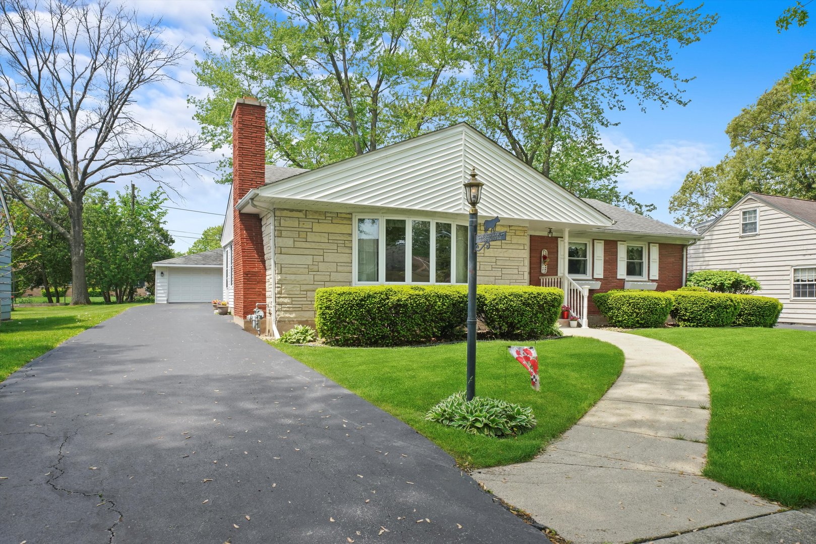 1350 Perry Street Crete, IL 60417 - Photo 2 of 17 a front view of a house with a yard and trees