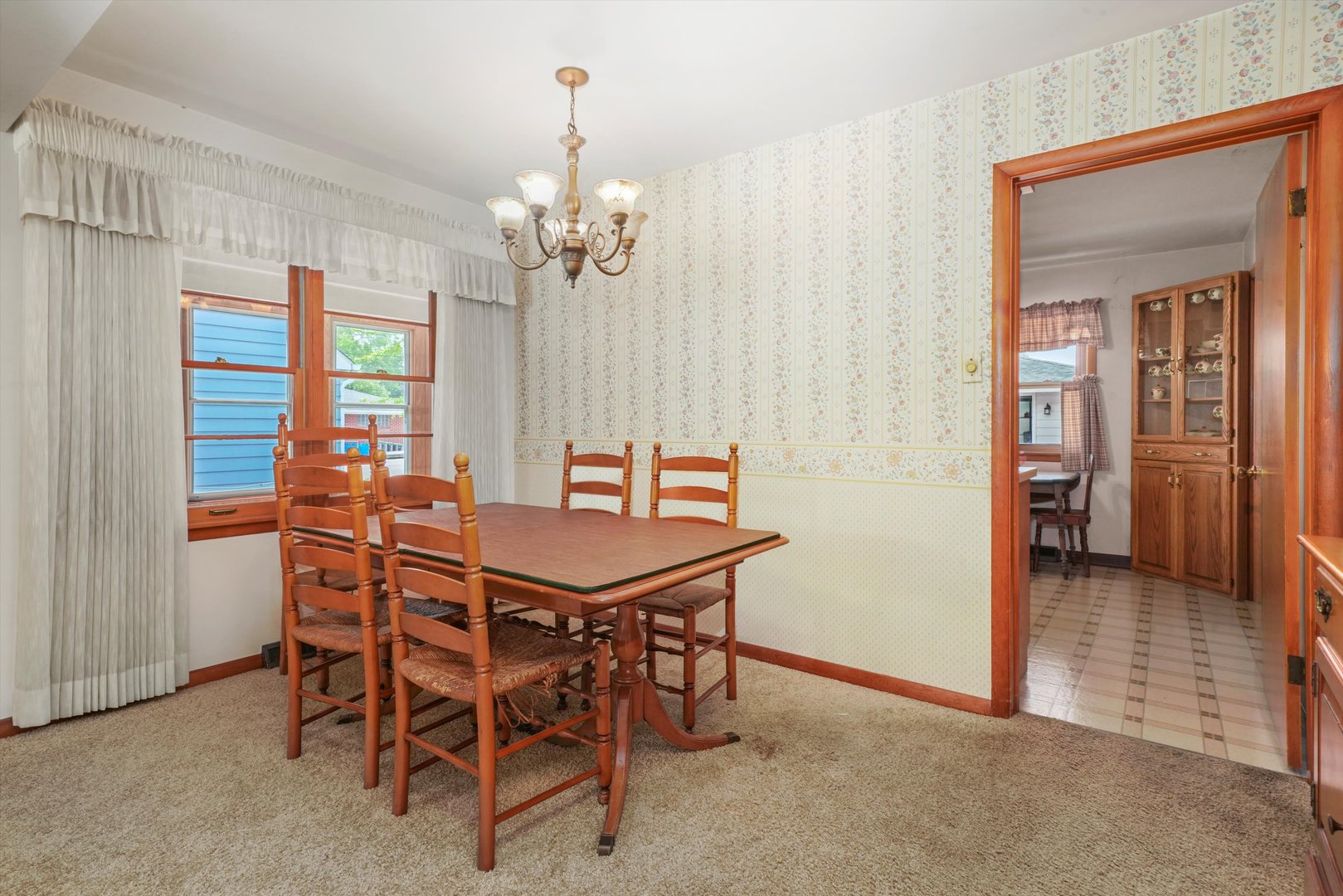 1350 Perry Street Crete, IL 60417 - Photo 6 of 17 a view of a dining room with furniture and a chandelier