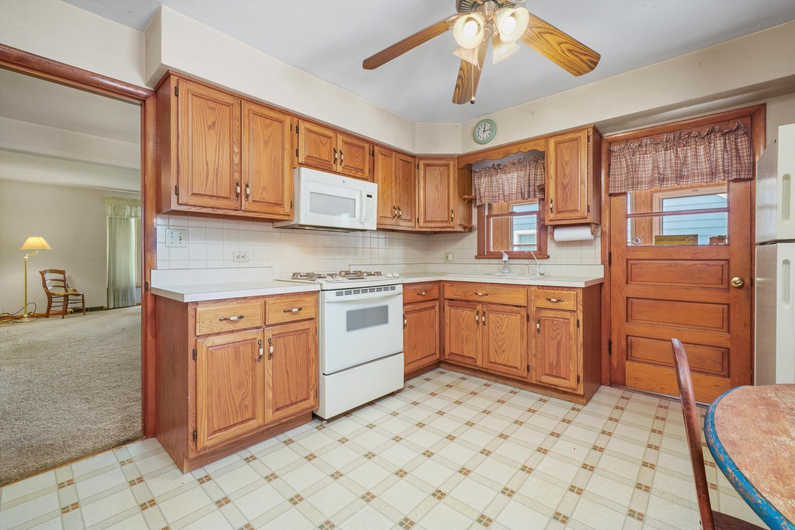 1350 Perry Street Crete, IL 60417 - Photo 7 of 17 a kitchen with stainless steel appliances granite countertop a sink and cabinets