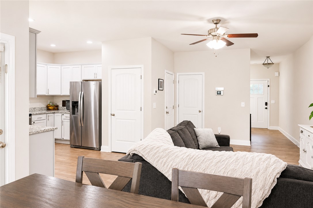 102 Ventura Street Anderson, SC 29621 - Photo 6 of 24 An open-concept living space integrates a well-appointed kitchen and comfortable lounge area.