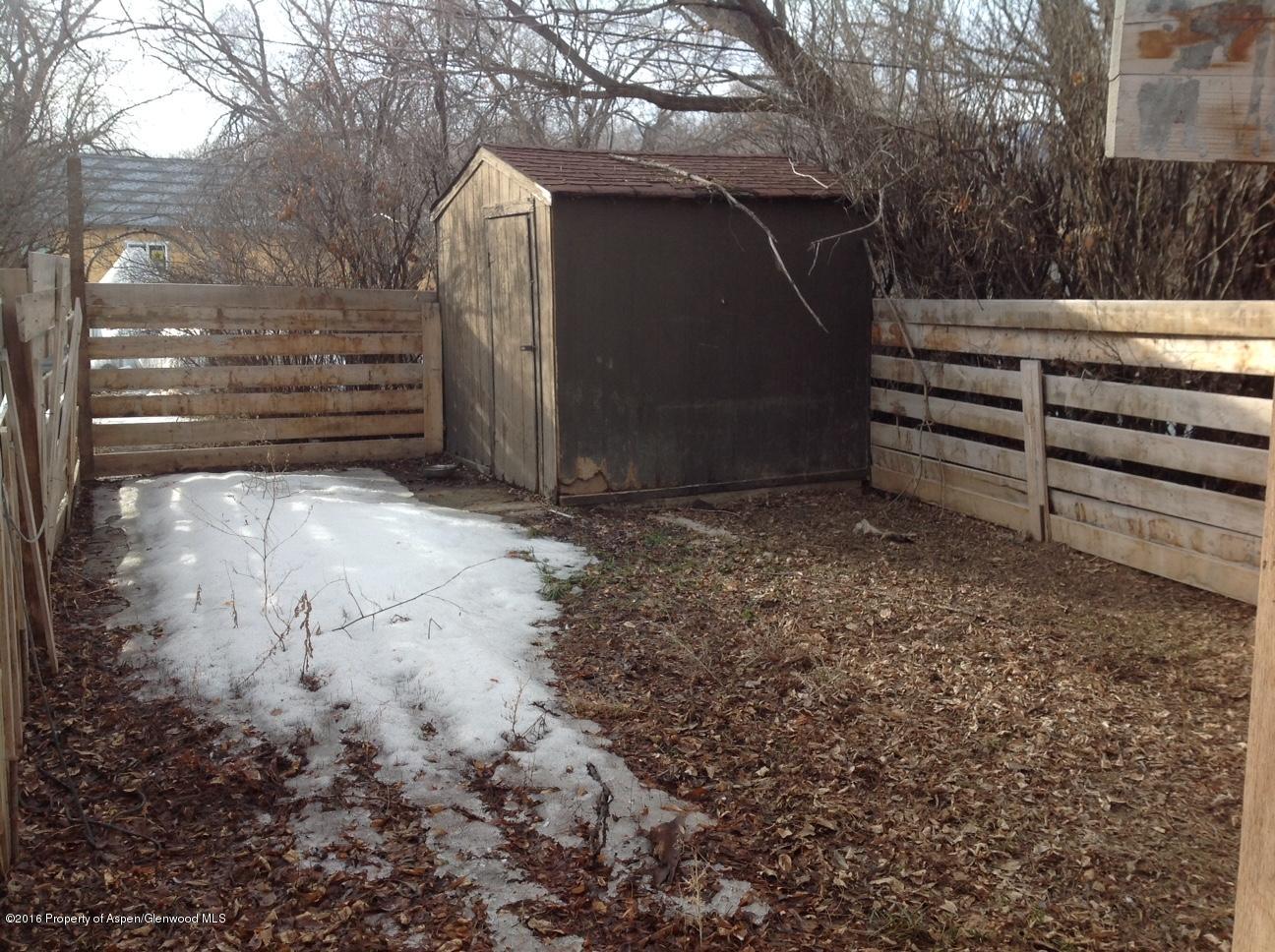 125 Daniel Avenue Rifle, CO 81650 - Photo 5 of 12 a view of backyard with wooden fence