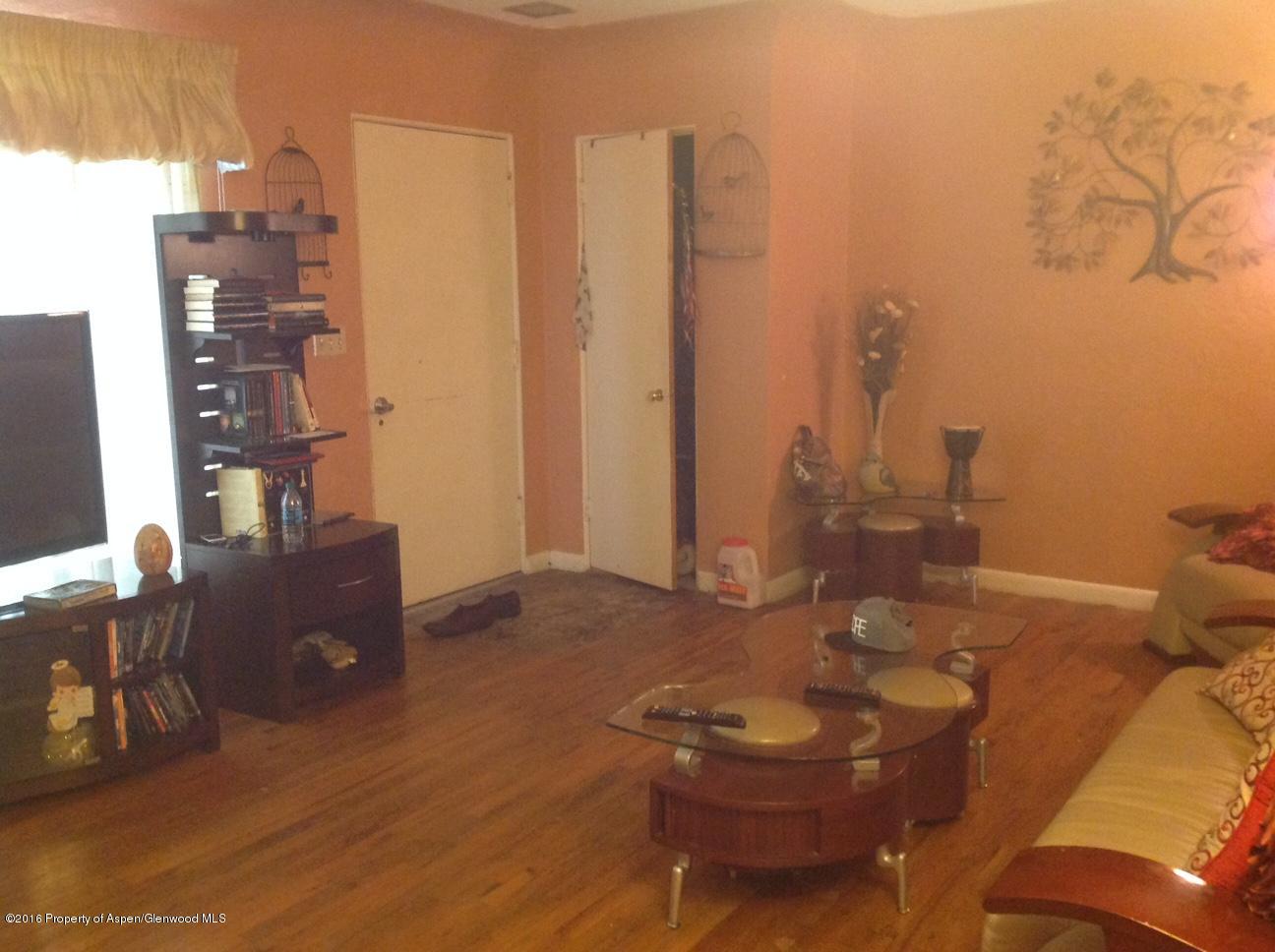 125 Daniel Avenue Rifle, CO 81650 - Photo 6 of 12 a living room with furniture and a flat screen tv