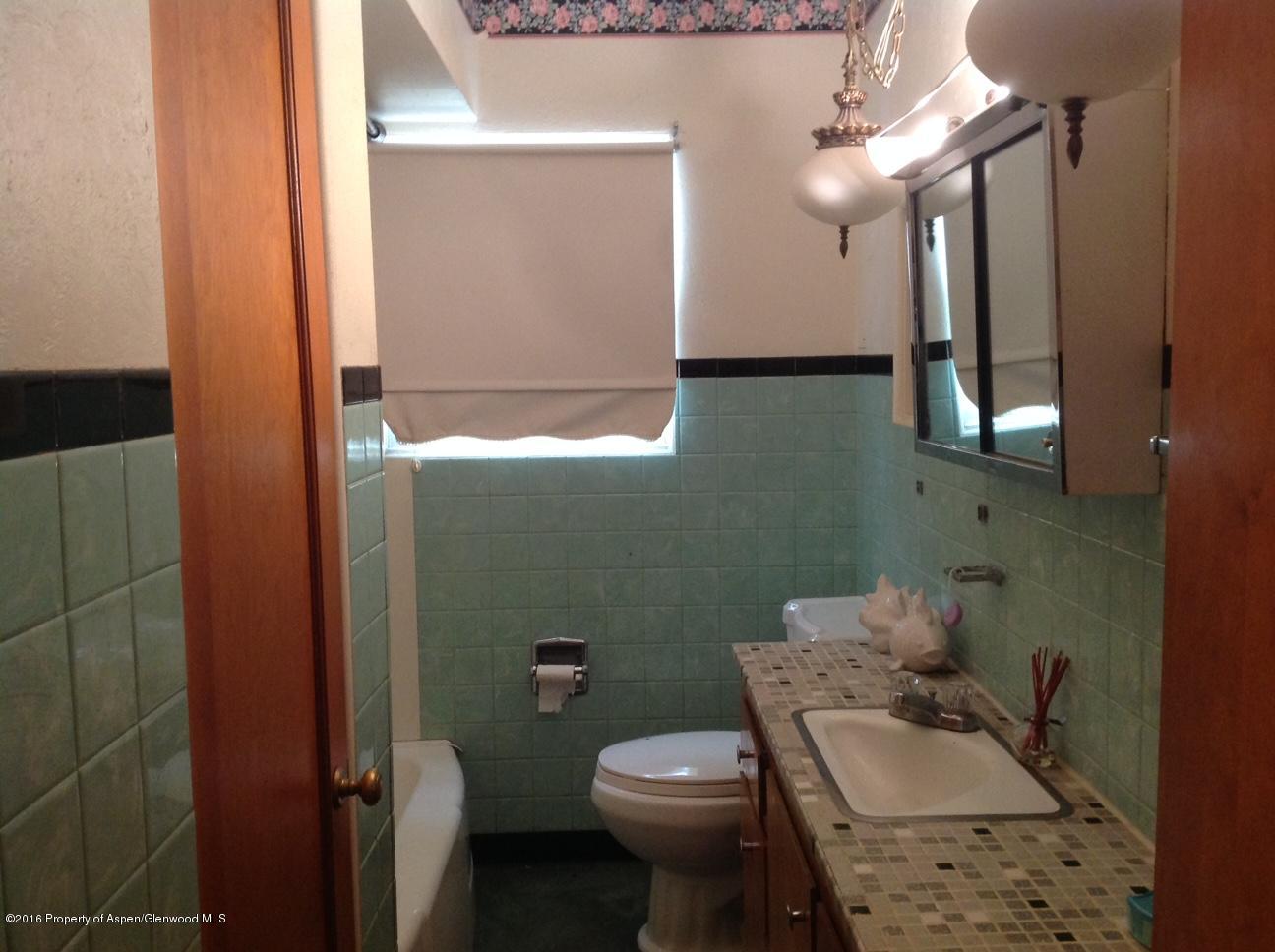 125 Daniel Avenue Rifle, CO 81650 - Photo 9 of 12 a bathroom with a sink toilet and shower