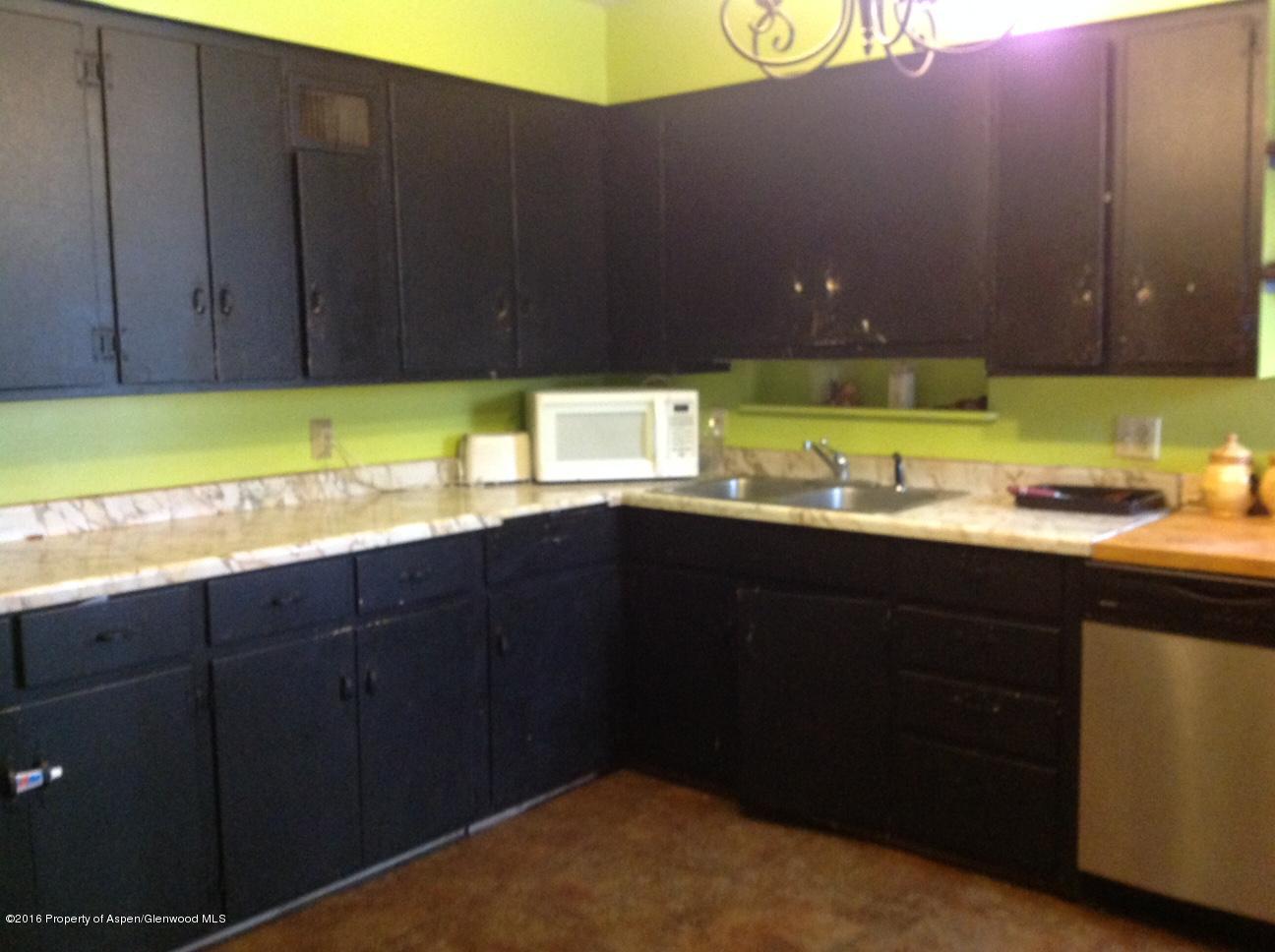125 Daniel Avenue Rifle, CO 81650 - Photo 10 of 12 a kitchen with a sink and cabinets