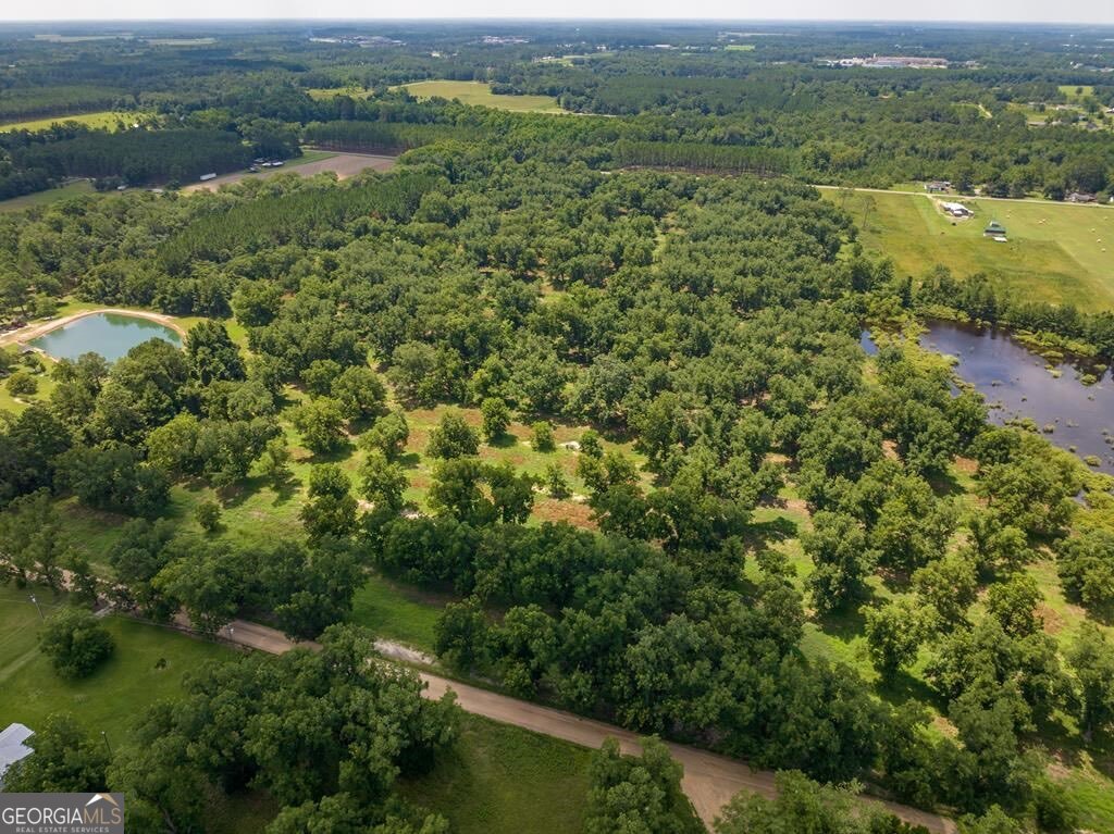 229 Hudson Road Fitzgerald, GA 31750 - Photo 5 of 16 an aerial view of residential houses with outdoor space and trees