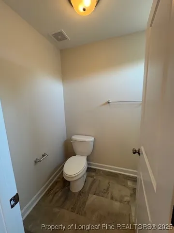 a bathroom with a toilet and a sink
