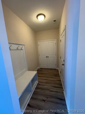 a view of a hallway with staircase