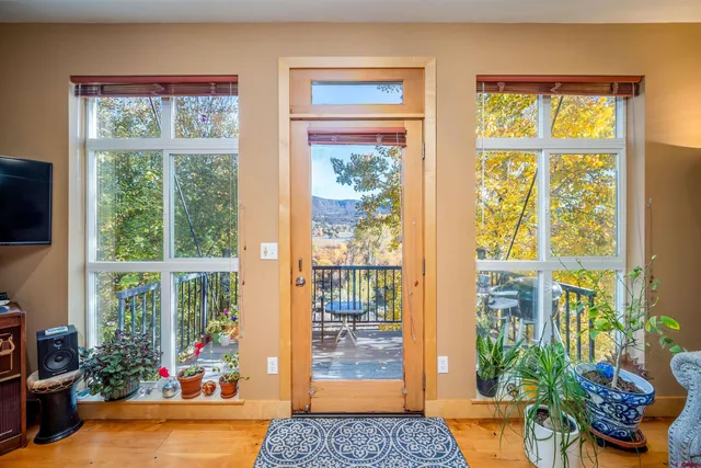 a living room filled with furniture and a window
