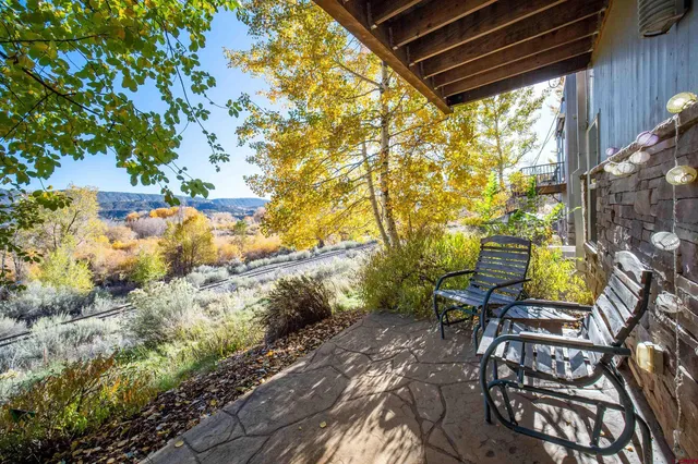 a view of swimming pool with outdoor seating and plants