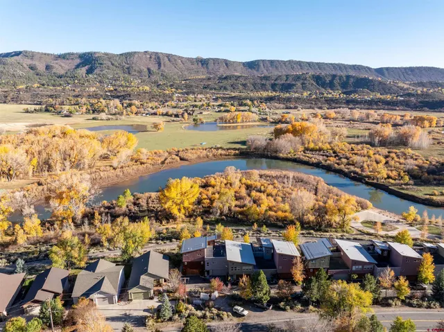 an aerial view of residential building and lake view
