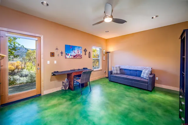 a view of a room with furniture and a chandelier