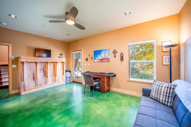 a living room with furniture and a window