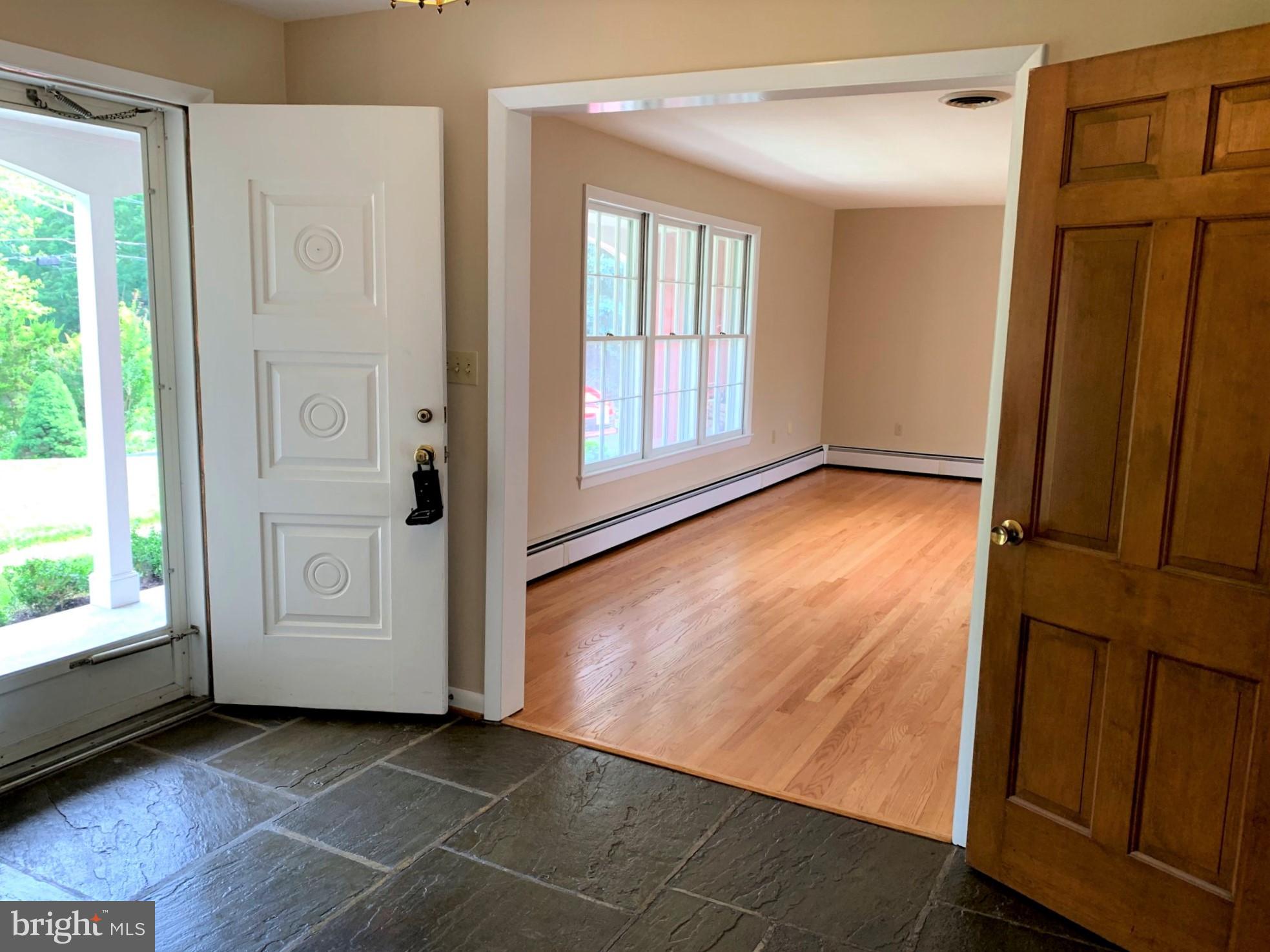 10100 Clearspring Road Damascus, MD 20872 - Photo 10 of 37 Double front doors with slate floored foyer