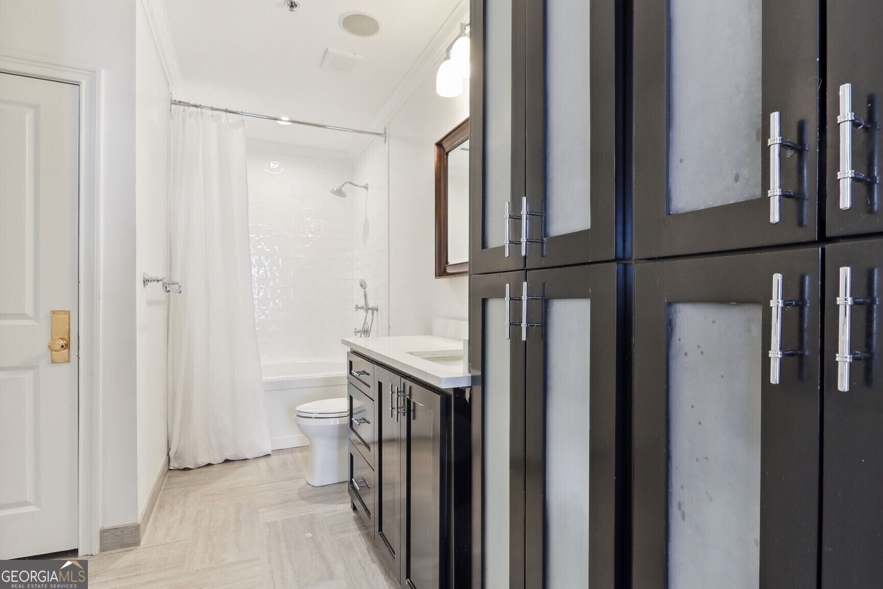 2255 Peachtree Road Northeast, Unit 825 Atlanta, GA 30305 - Photo 13 of 15 a bathroom with a granite countertop sink and a mirror
