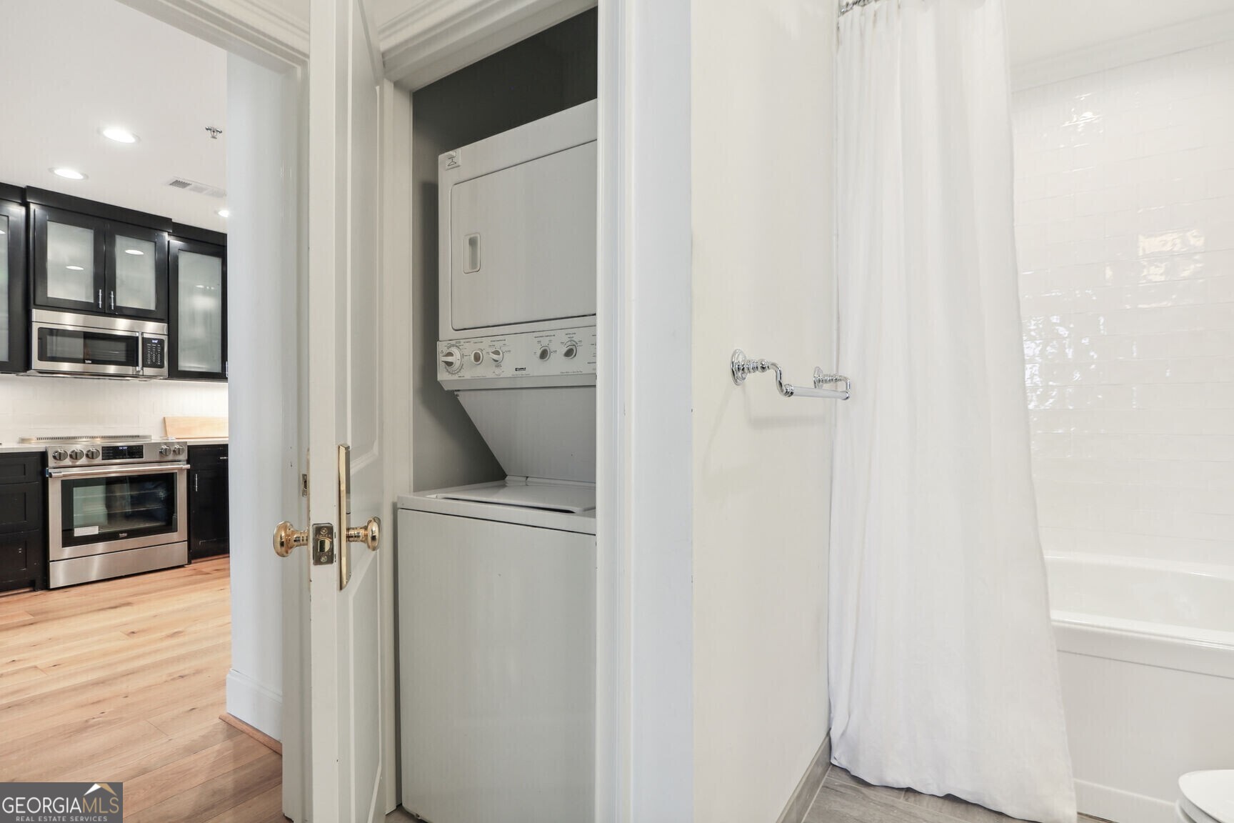 2255 Peachtree Road Northeast, Unit 825 Atlanta, GA 30305 - Photo 15 of 15 a view of hallway with washer and dryer