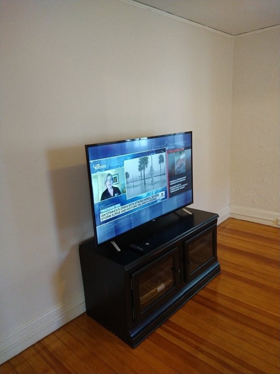 25 Bayard Street, Unit 2 Dedham, MA 02026 - Photo 3 of 5 a view of table with wooden floor
