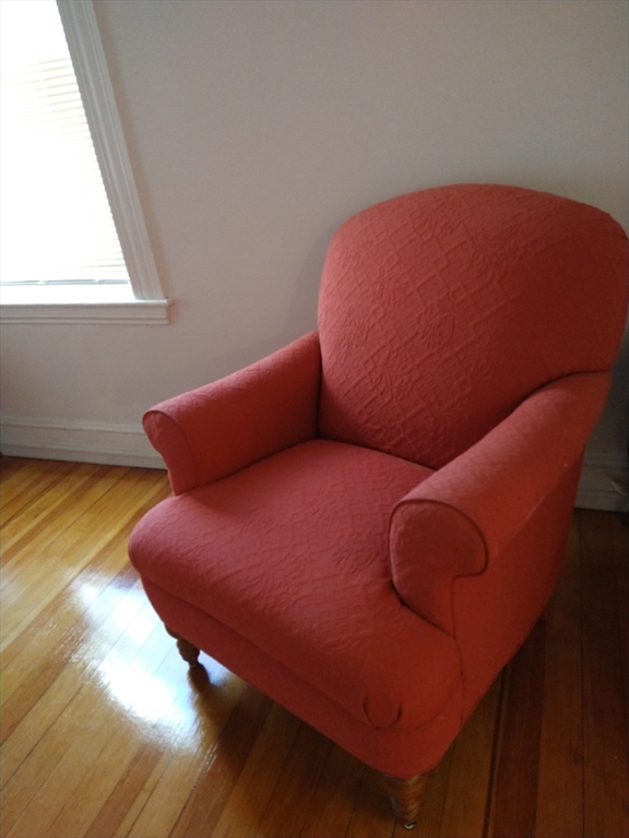 25 Bayard Street, Unit 2 Dedham, MA 02026 - Photo 5 of 5 a blue bed sitting in a bedroom next to a window
