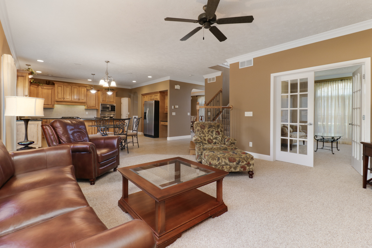 4012 Rockledge Road Bloomington, IL 61705 - Photo 12 of 63 a living room with furniture and a chandelier