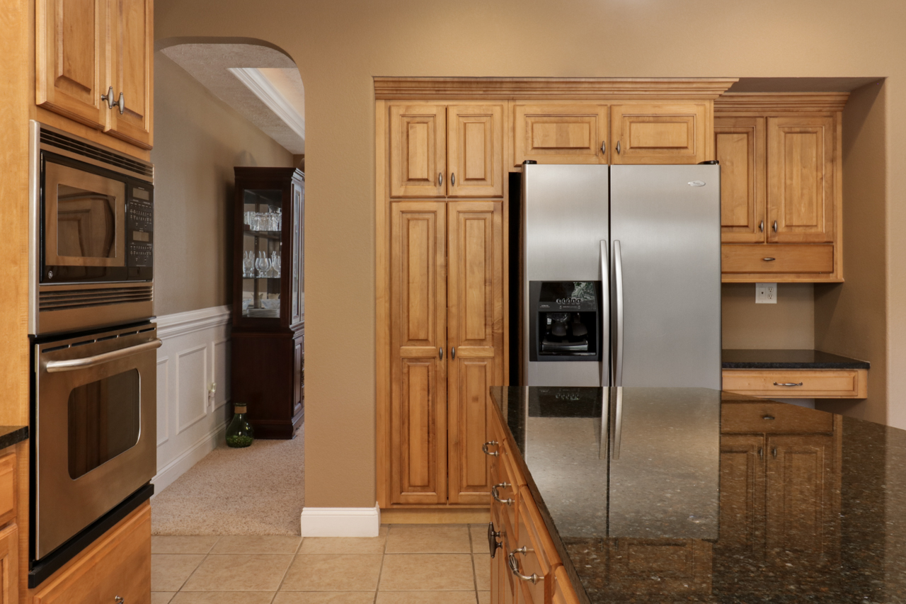 4012 Rockledge Road Bloomington, IL 61705 - Photo 22 of 63 a kitchen with stainless steel appliances granite countertop a refrigerator and a stove