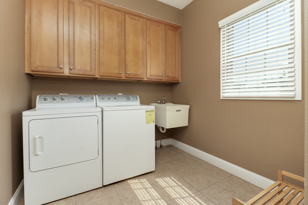 4012 Rockledge Road Bloomington, IL 61705 - Photo 27 of 63 a view of storage and utility room with washer and dryer