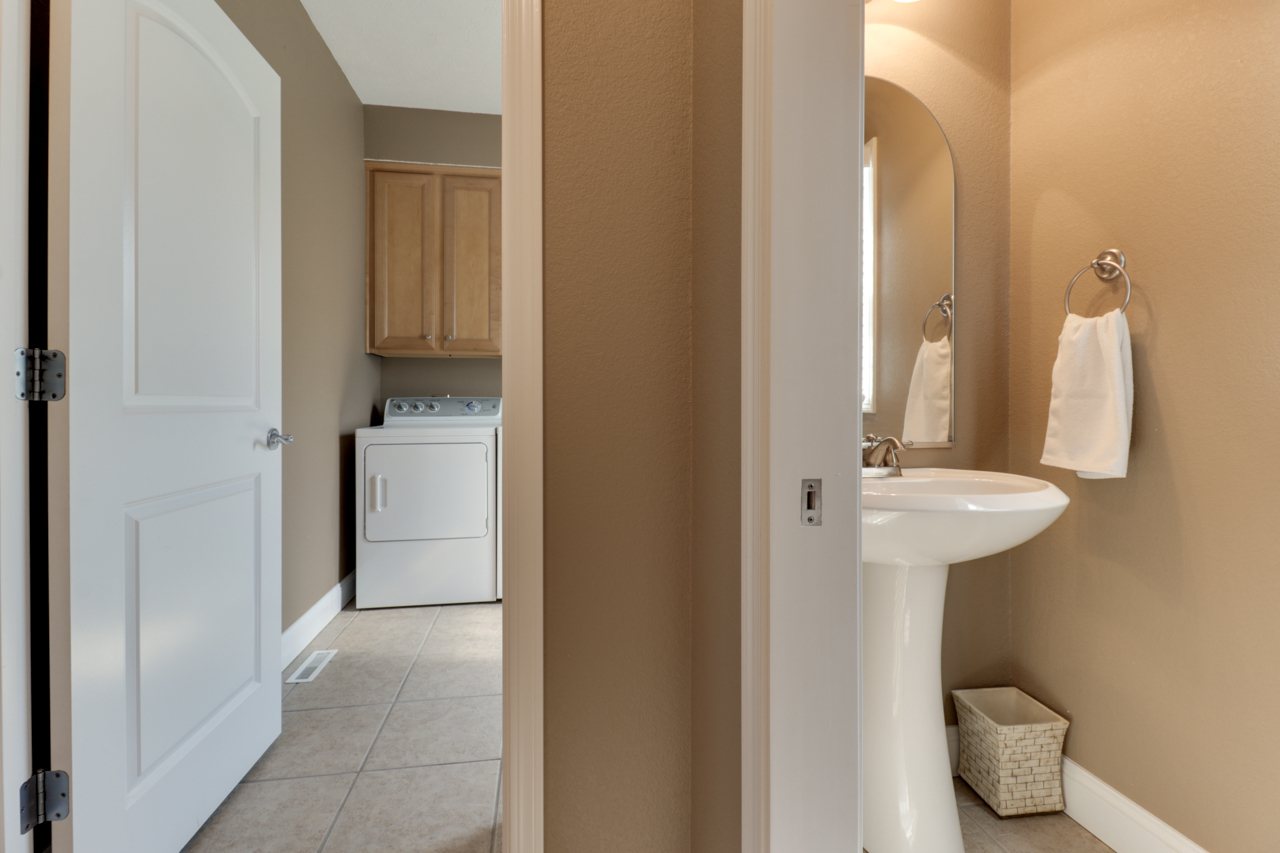 4012 Rockledge Road Bloomington, IL 61705 - Photo 28 of 63 a bathroom with a sink and a mirror