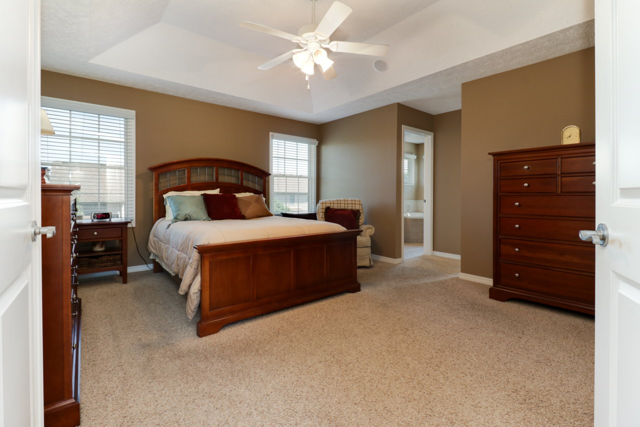 4012 Rockledge Road Bloomington, IL 61705 - Photo 30 of 63 a bedroom with a bed and a dresser