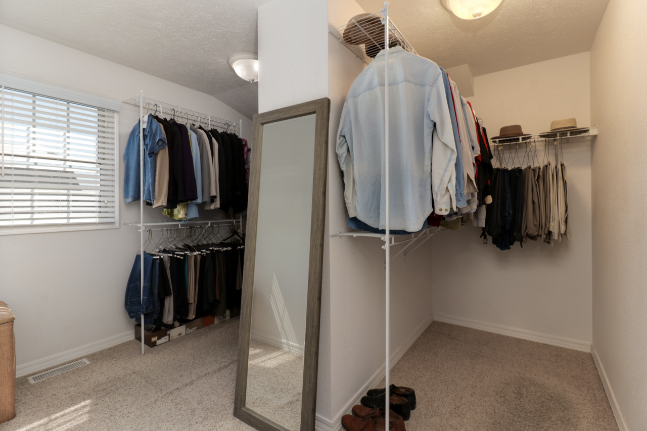 4012 Rockledge Road Bloomington, IL 61705 - Photo 32 of 63 a view of walk in closet with clothes and shoes