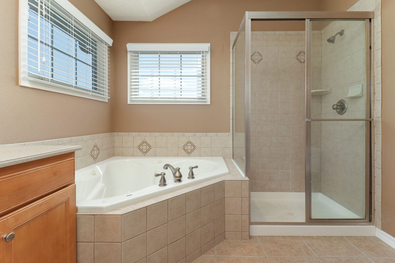 4012 Rockledge Road Bloomington, IL 61705 - Photo 34 of 63 a bathroom with a bathtub and a shower