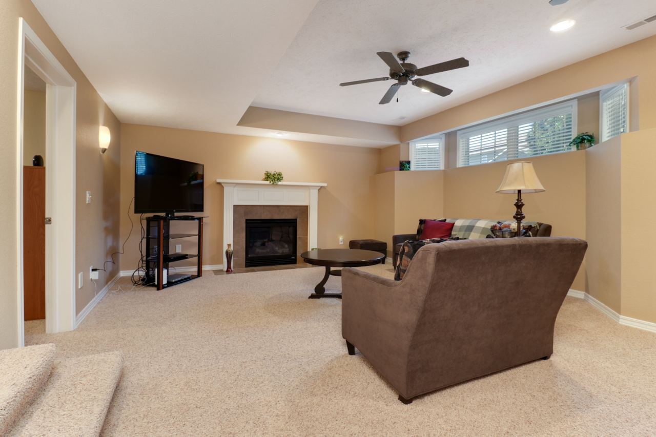 4012 Rockledge Road Bloomington, IL 61705 - Photo 42 of 63 a living room with furniture and a fireplace
