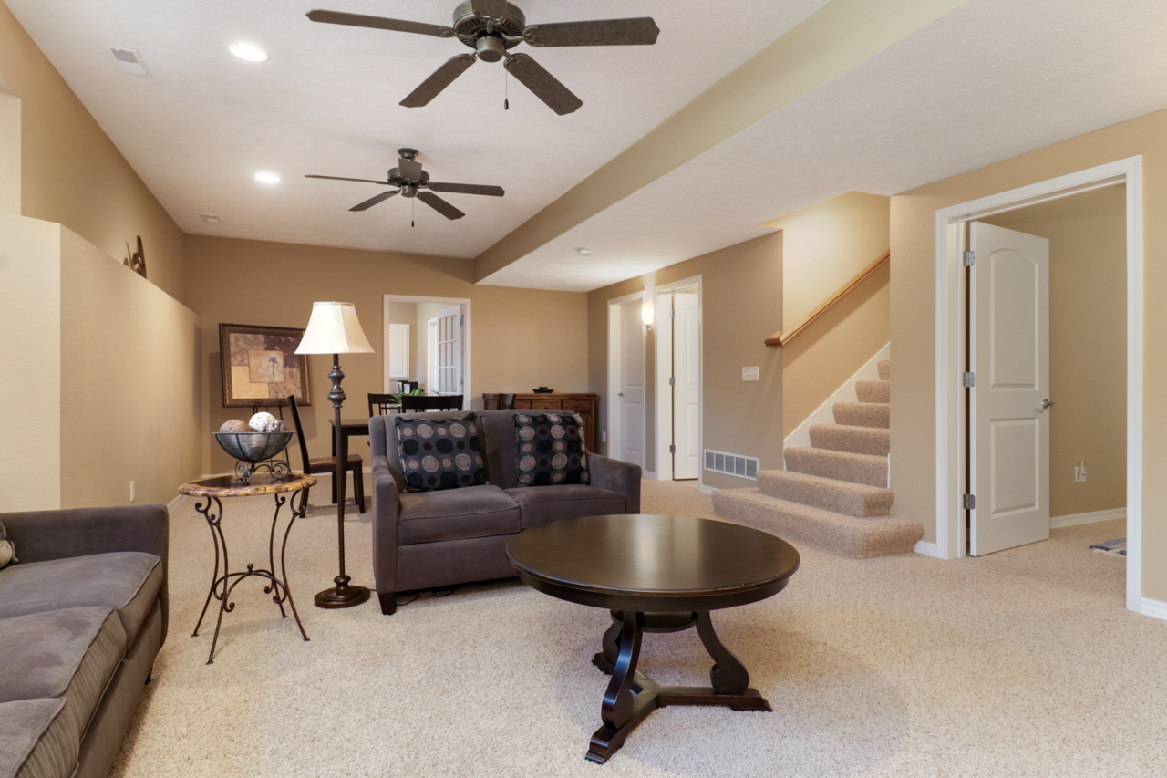 4012 Rockledge Road Bloomington, IL 61705 - Photo 43 of 63 a living room with furniture and a chandelier