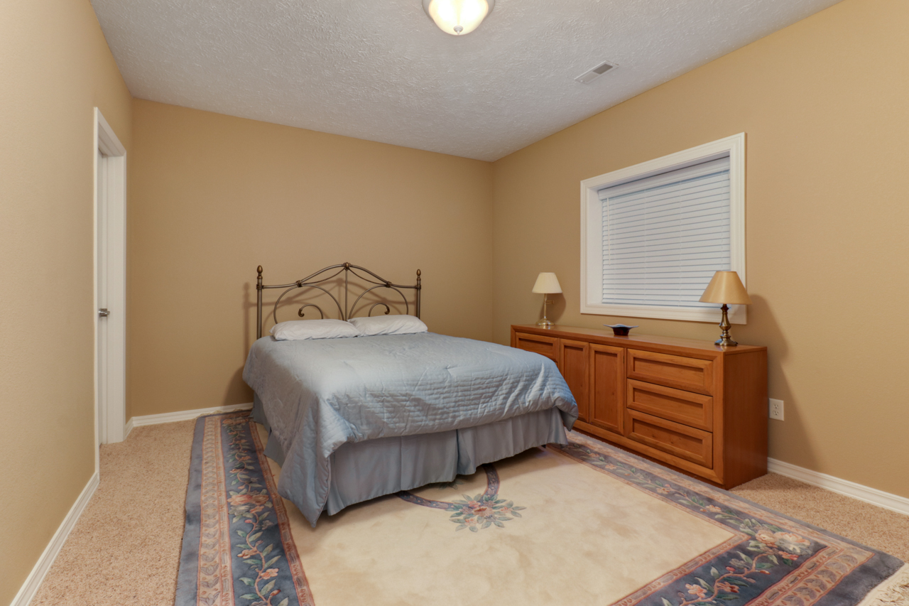 4012 Rockledge Road Bloomington, IL 61705 - Photo 46 of 63 a bedroom with a bed and a window