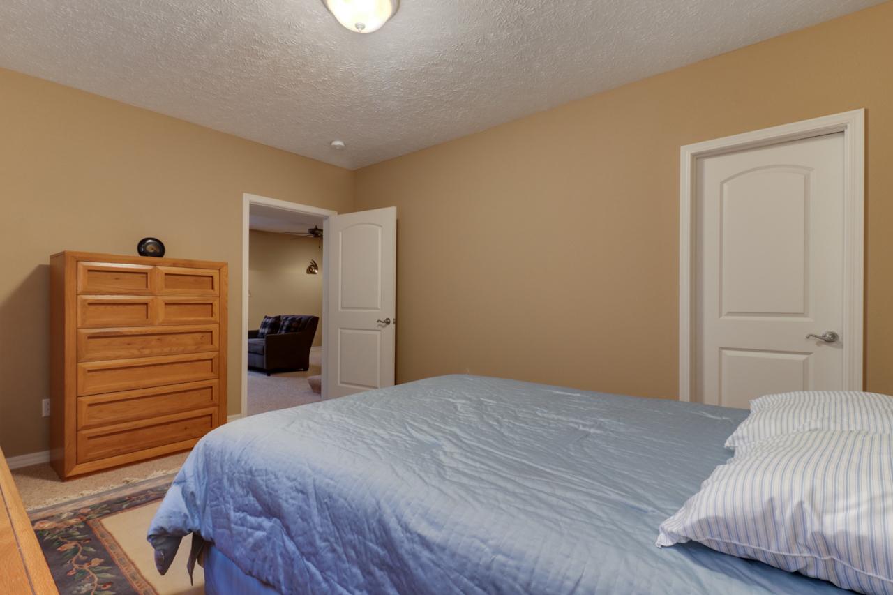 4012 Rockledge Road Bloomington, IL 61705 - Photo 47 of 63 a bedroom with a bed and a dresser