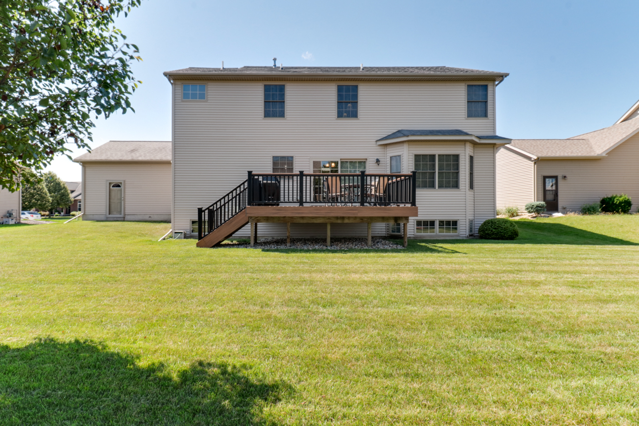 4012 Rockledge Road Bloomington, IL 61705 - Photo 51 of 63 a front view of a house with a garden