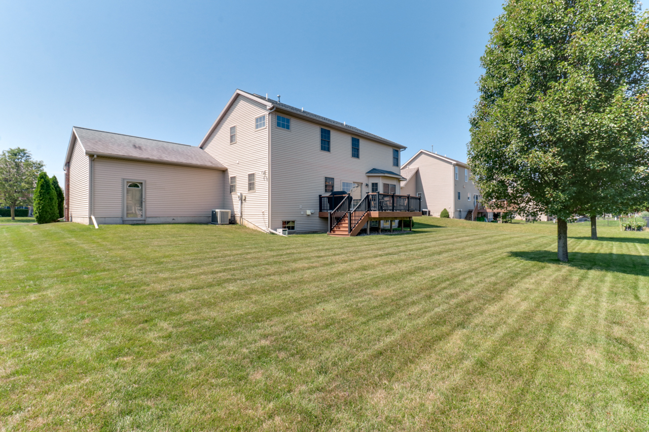 4012 Rockledge Road Bloomington, IL 61705 - Photo 52 of 63 a view of a house with a yard