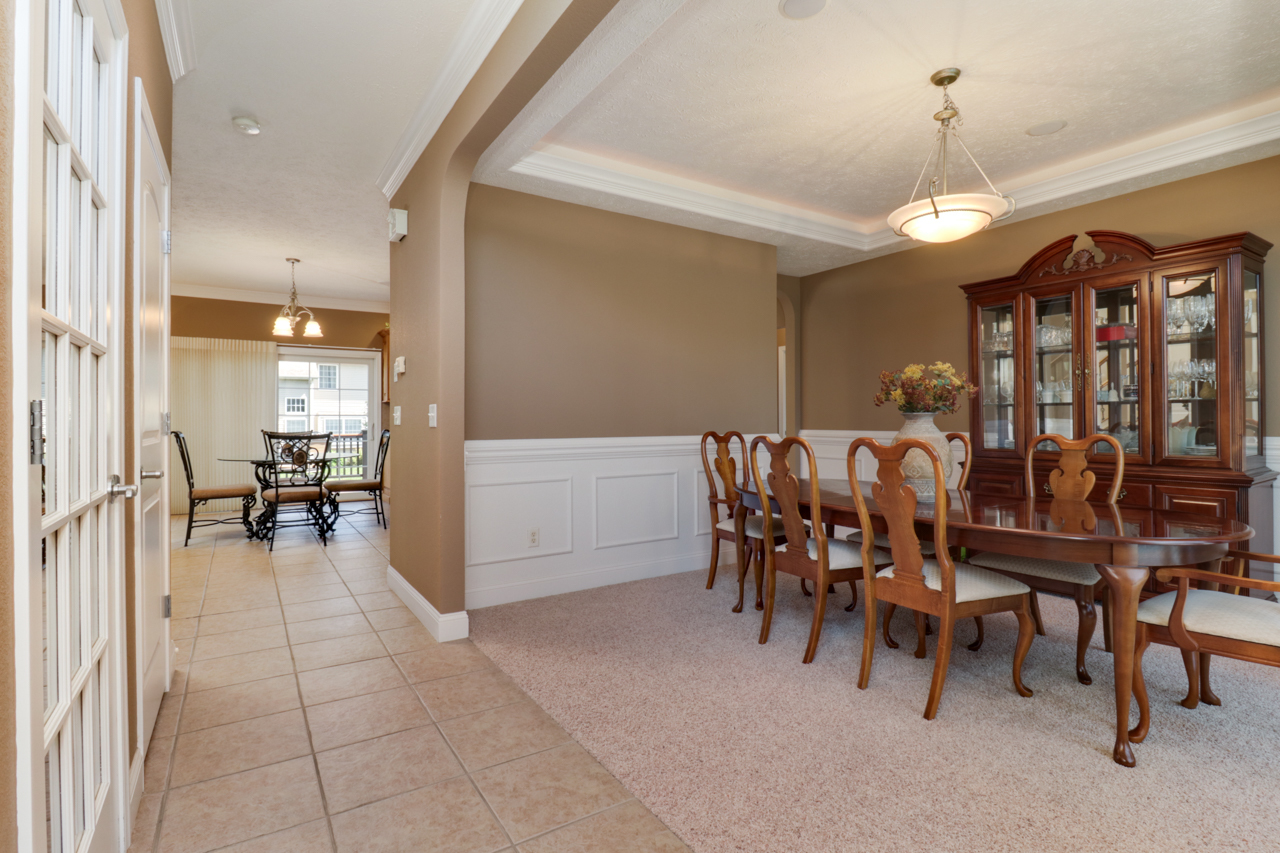 4012 Rockledge Road Bloomington, IL 61705 - Photo 6 of 63 a view of a dining room with furniture and a chandelier