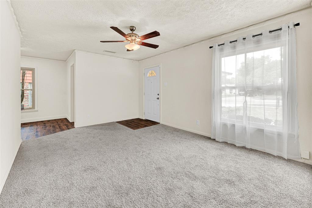 2418 Centerville Road Dallas, TX 75228 - Photo 4 of 22 Living Room from hallway, new carpet