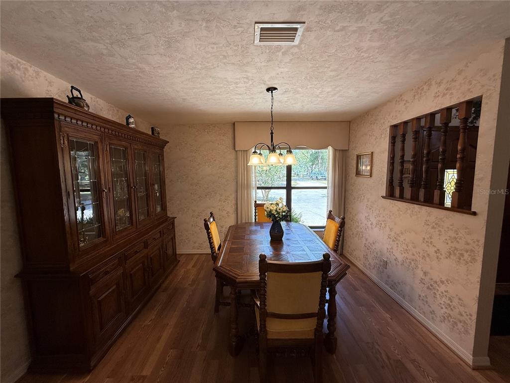 9901 Southwest 67th Terrace Ocala, FL 34476 - Photo 18 of 71 a dining room with furniture and window