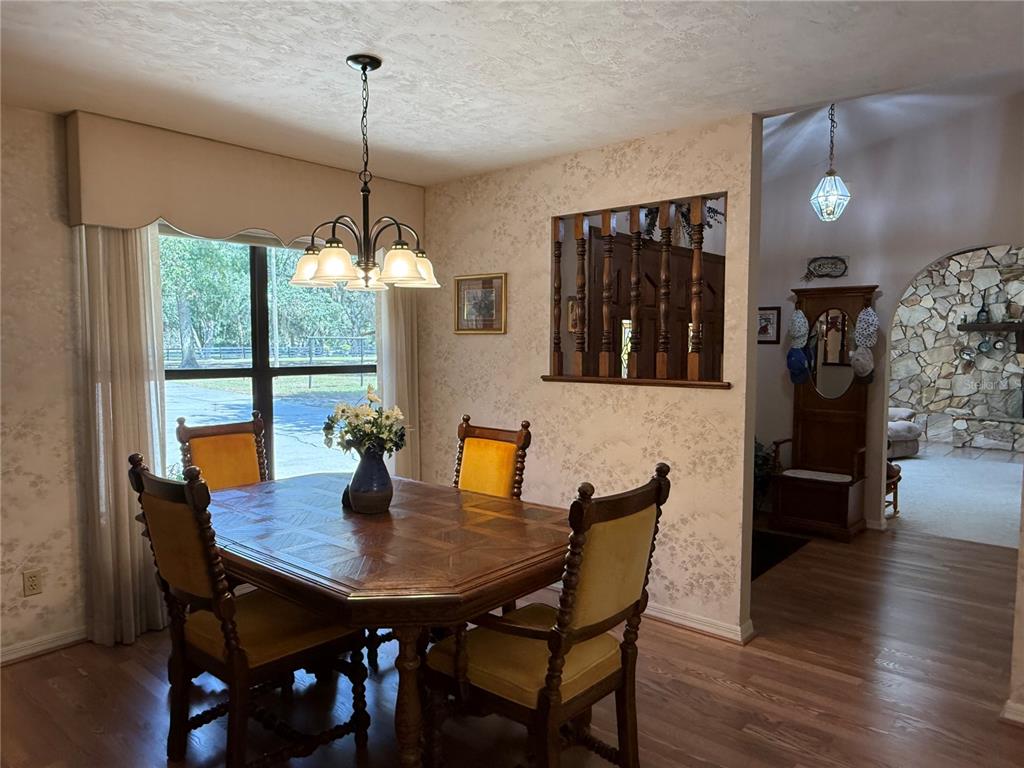 9901 Southwest 67th Terrace Ocala, FL 34476 - Photo 19 of 71 a dining room with furniture and window