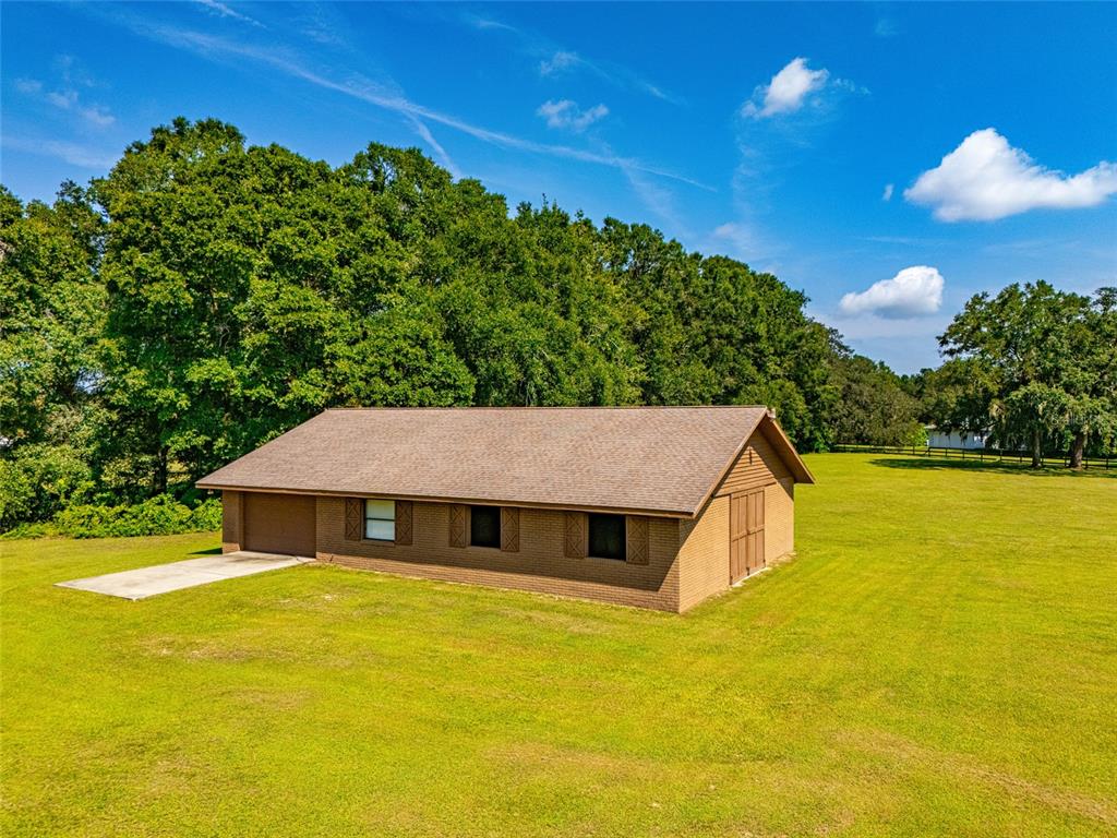 9901 Southwest 67th Terrace Ocala, FL 34476 - Photo 2 of 71 a aerial view of a house with swimming pool