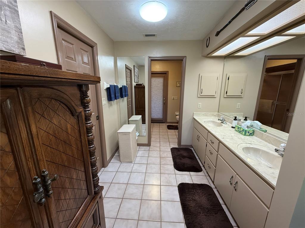 9901 Southwest 67th Terrace Ocala, FL 34476 - Photo 24 of 71 a kitchen with a sink a stove a washer and dryer